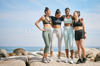 Buy stock photo Shot of a group of friends taking a break during a workout