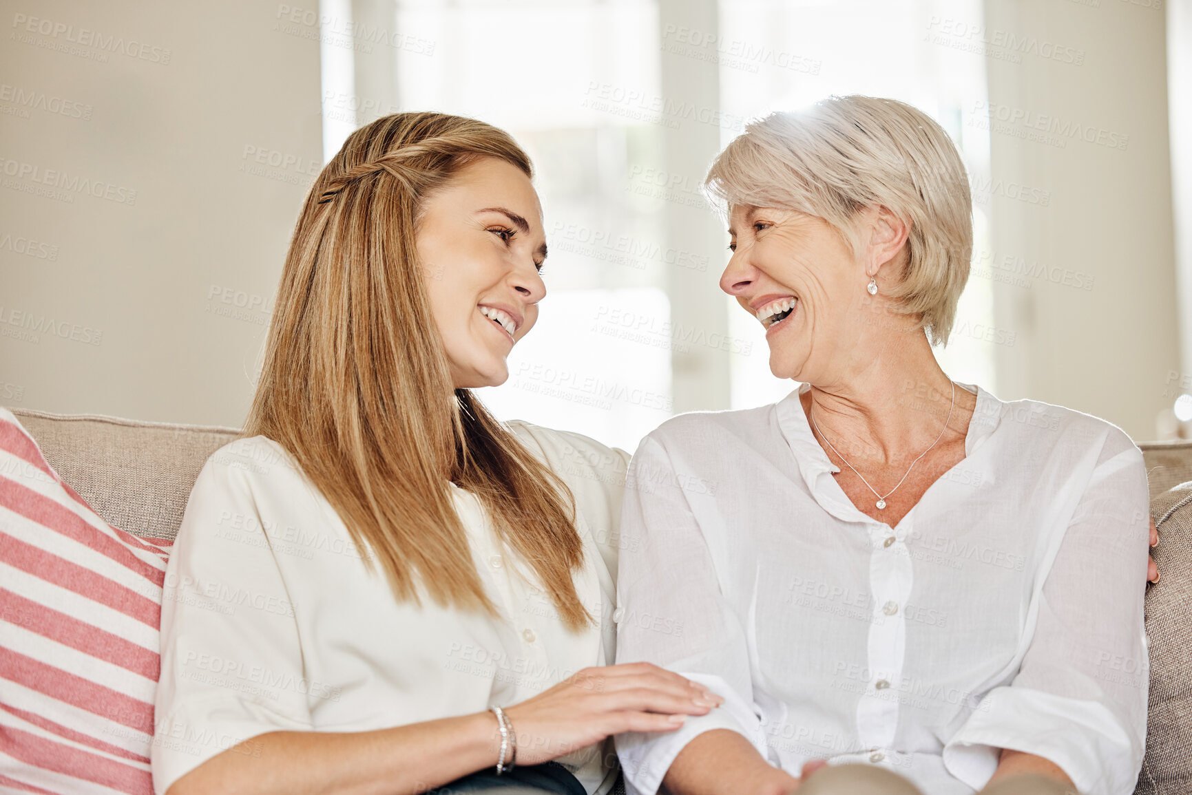 Buy stock photo Home, smile and woman with senior mother on sofa for bonding connection, love and care on weekend. Relax, family and people with hug in living room for conversation, happiness and visit in house