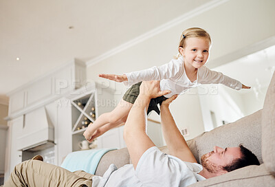 Buy stock photo Shot of a father and his daughter playing at home