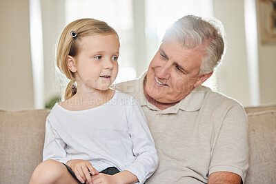 Buy stock photo Shot of a grandpa and his granddaughter at home