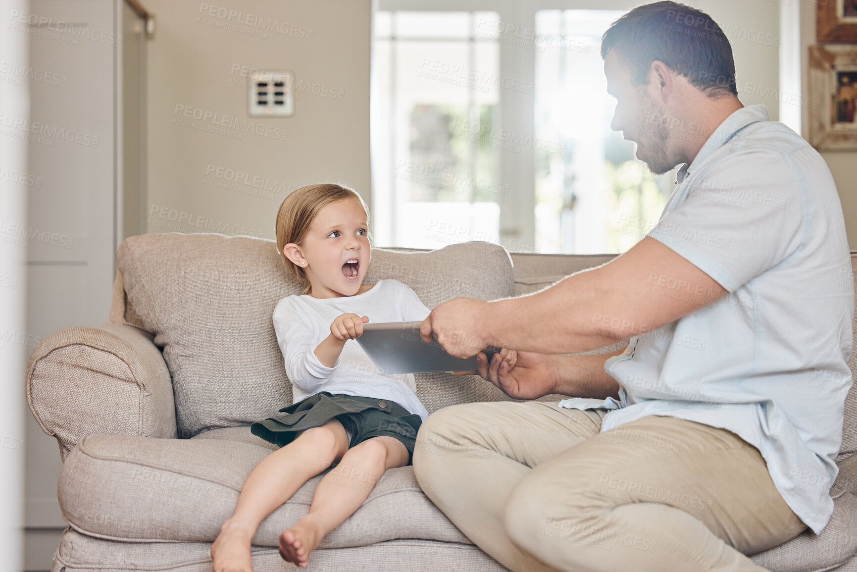 Buy stock photo Tablet, conflict and dad with child on sofa for discipline, bad behaviour and frustrated in home. Family, upset and father with young girl on digital tech for argument, fight and ban for screen time