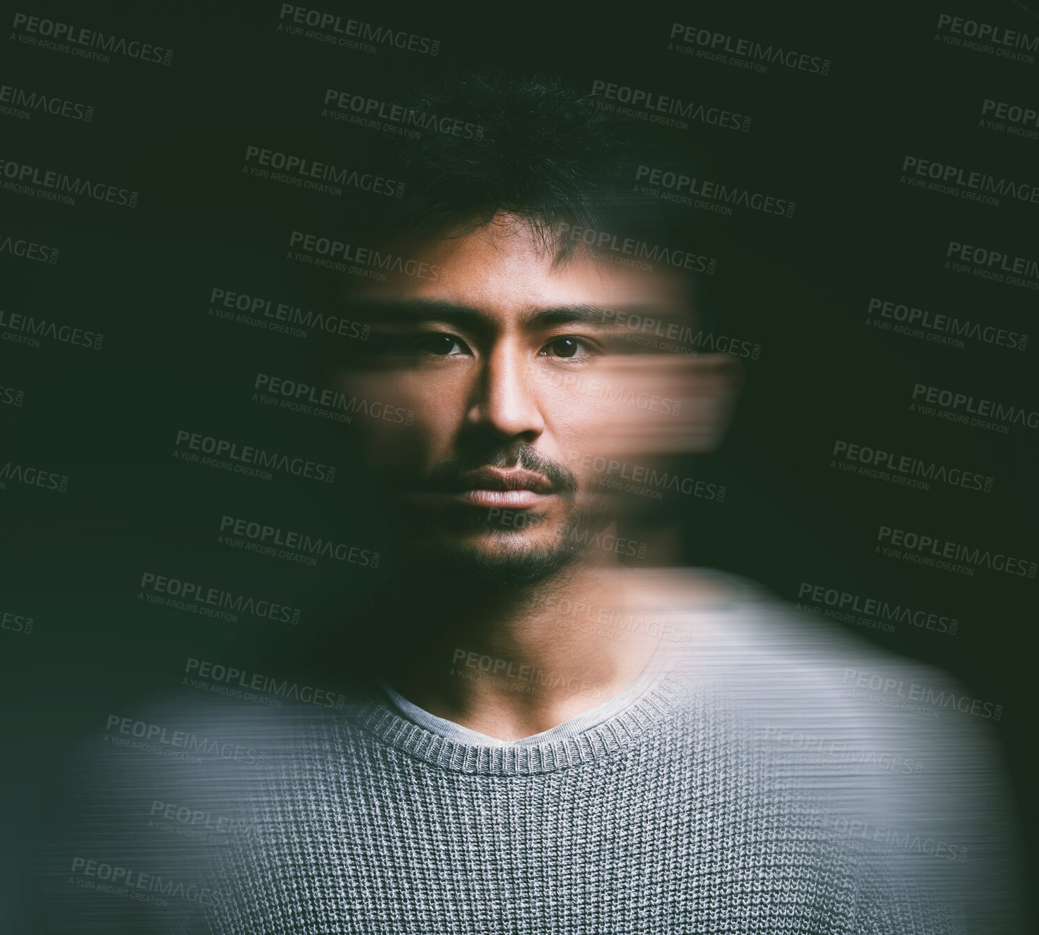 Buy stock photo Studio shot of a young man experiencing mental illness against a blurred black background