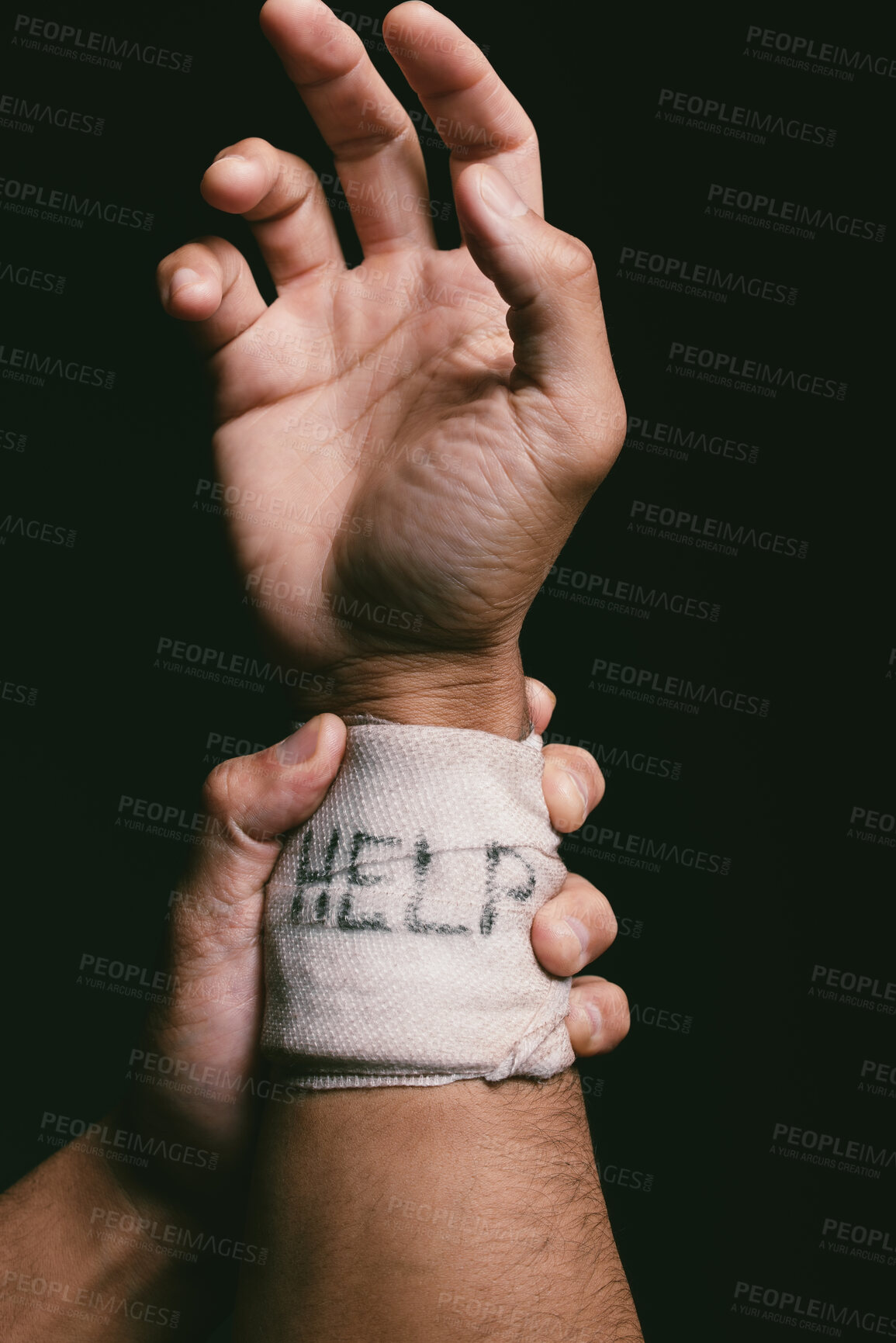 Buy stock photo Hand, bandage and help in dark background for depression, bipolar disorder and anxiety with self harm. Studio, wrist and actions of person with injury, accident and seek assistance for mental health