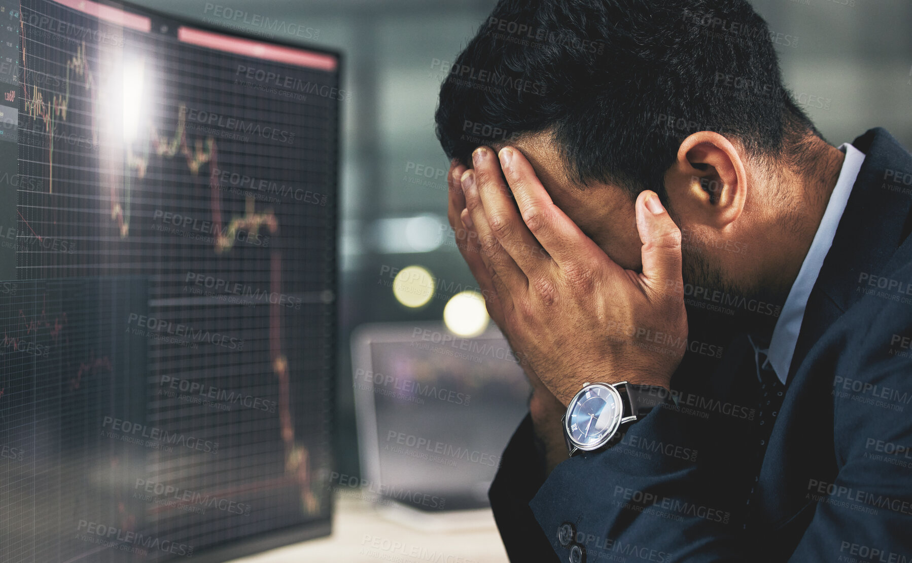 Buy stock photo Shot of a young stock market expert looking stressed out at work