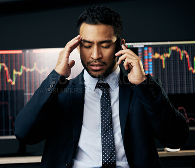 Buy stock photo Shot of a young businessman making a phone call in order to monitor the stock market