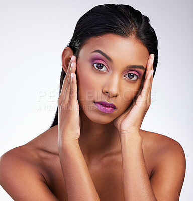 Buy stock photo Studio, portrait and Indian woman with makeup, beauty and facial aesthetic with confidence. Female model, vibrant glow and cosmetics by white background, eyeshadow and lipstick with hand gesture