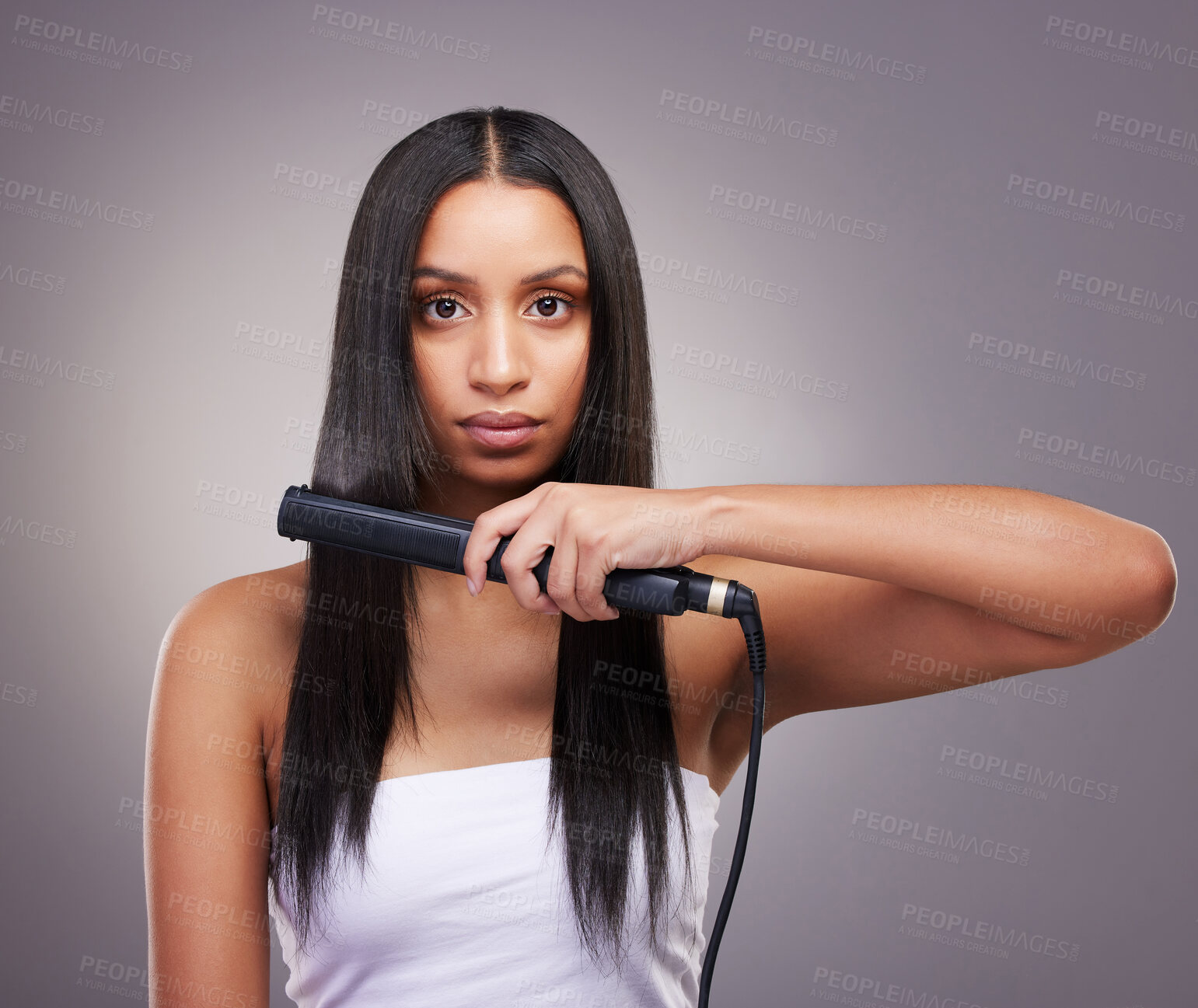 Buy stock photo Portrait, woman and hair straightener for grooming and self care in studio grey background. Female person, beauty and flat iron cosmetic equipment for fresh treatment, salon shine and wellness