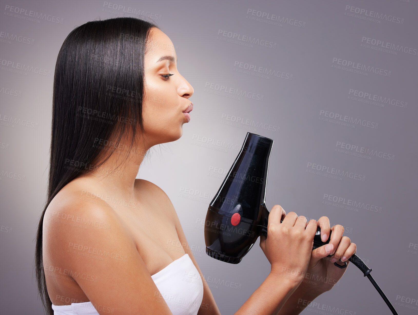 Buy stock photo Cosmetics, woman and hairdryer in studio grey background for wellness and self care. Female person, heat treatment and equipment isolated on backdrop for salon texture, style and keratin shine