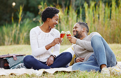 Buy stock photo Black couple, wine and picnic at park with cheers for anniversary date, honeymoon celebration and romance with smile. People, relax and happy on grass in nature with support, success and holiday fun