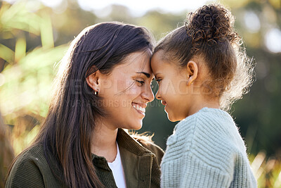 Buy stock photo Happy, bonding and mother and child in nature for love, gratitude and kindness on mothers day. Smile, calm and a young mom with a girl kid and happiness, care and together in a park for quality time