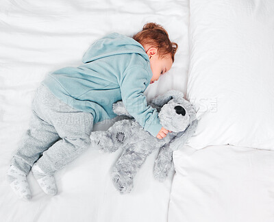 Buy stock photo Peace, sleeping and baby with teddy bear on bed in top view house for resting, dream or afternoon nap. Child development, toy and calm boy kid in a bedroom for morning routine, relax and quiet snooze