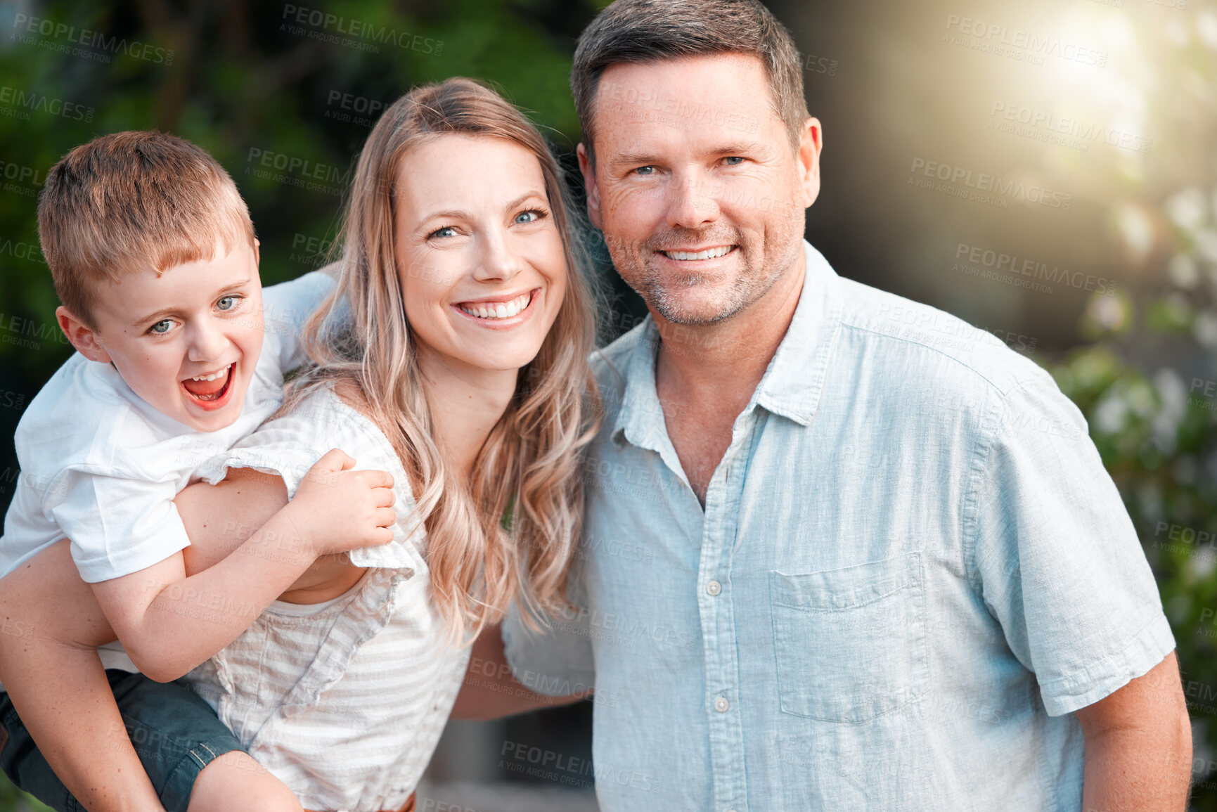 Buy stock photo Piggyback, boy and happy family in outside portrait together, parents and child in garden for bonding on weekend break. Summer, love and smile or care on holiday, nature trees and support in backyard