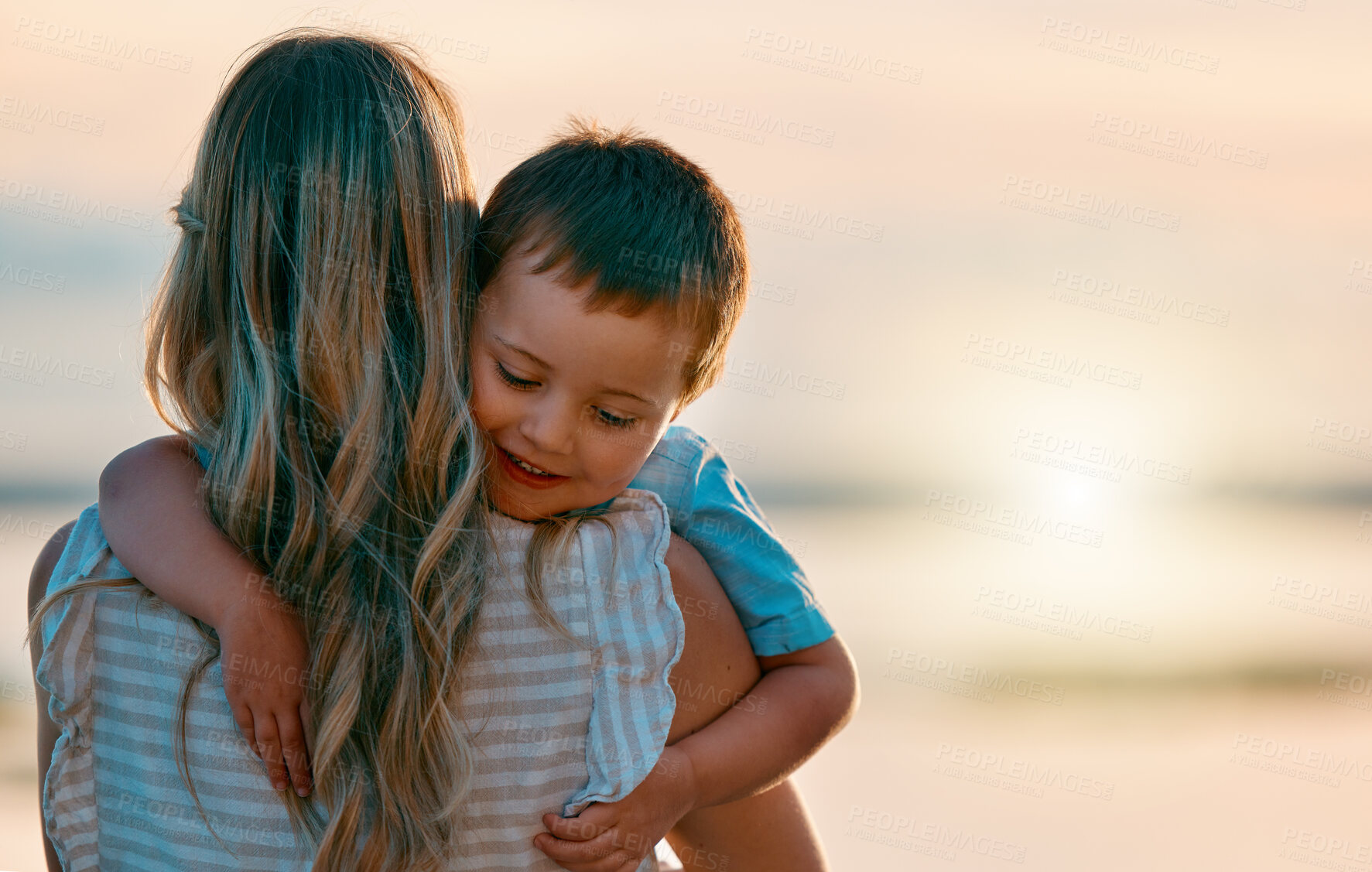 Buy stock photo Mother, son and hug at beach for sunset with bonding, summer holiday and adventure with mockup. Happy family, mom and boy child with embrace, back and relax outdoor with sunrise and love at ocean