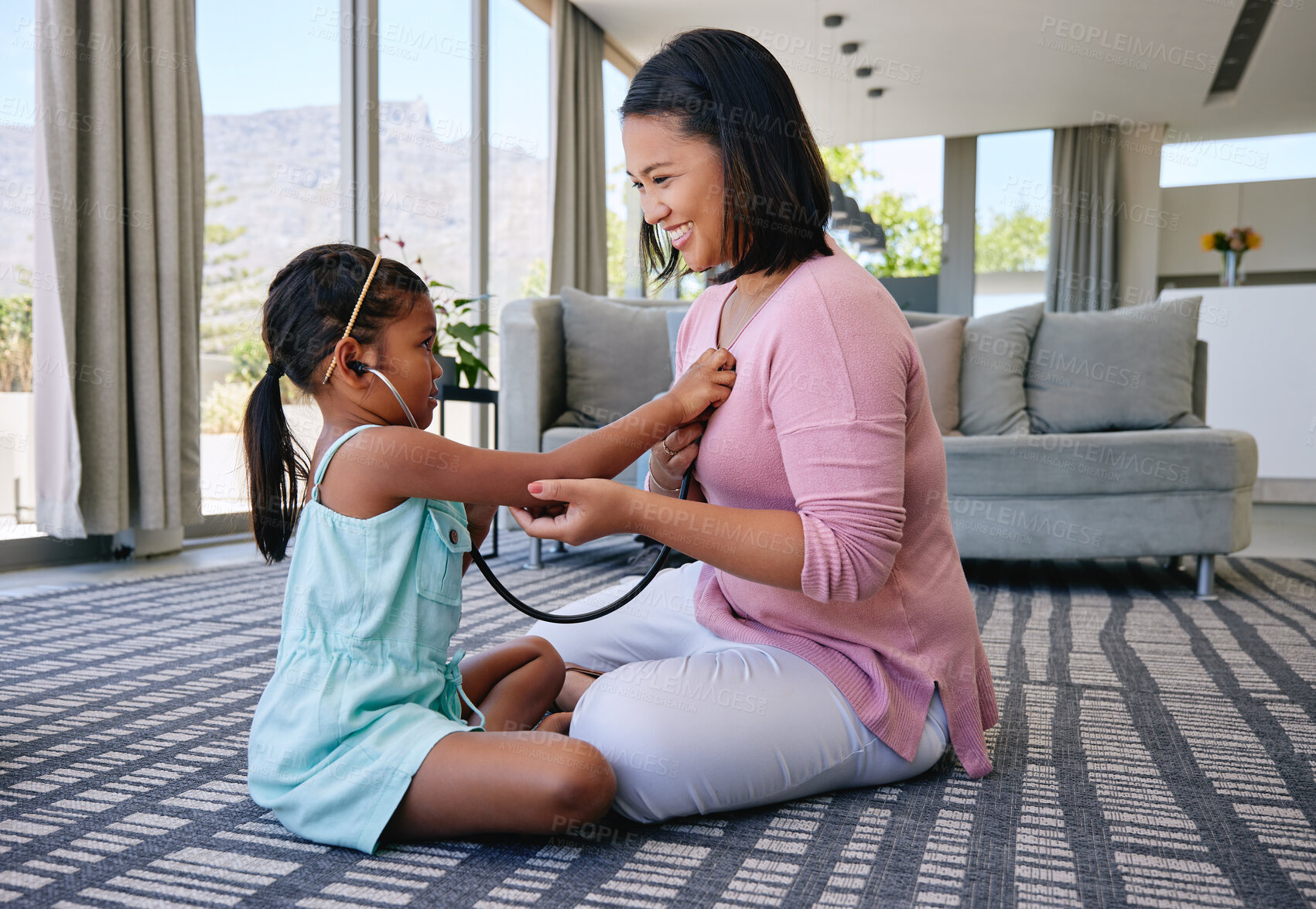 Buy stock photo Happy, parent and kid playing as doctor with stethoscope for child development, learning and fun. Family, bonding and girl listening for heartbeat, with medical tool for growth and education at home
