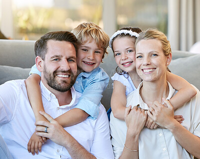 Buy stock photo Shot of a young family relaxing together at home
