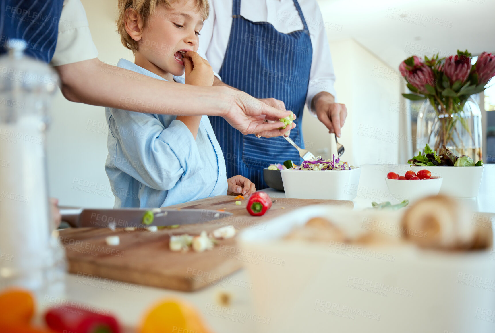 Buy stock photo Shot of a family cooking together at home