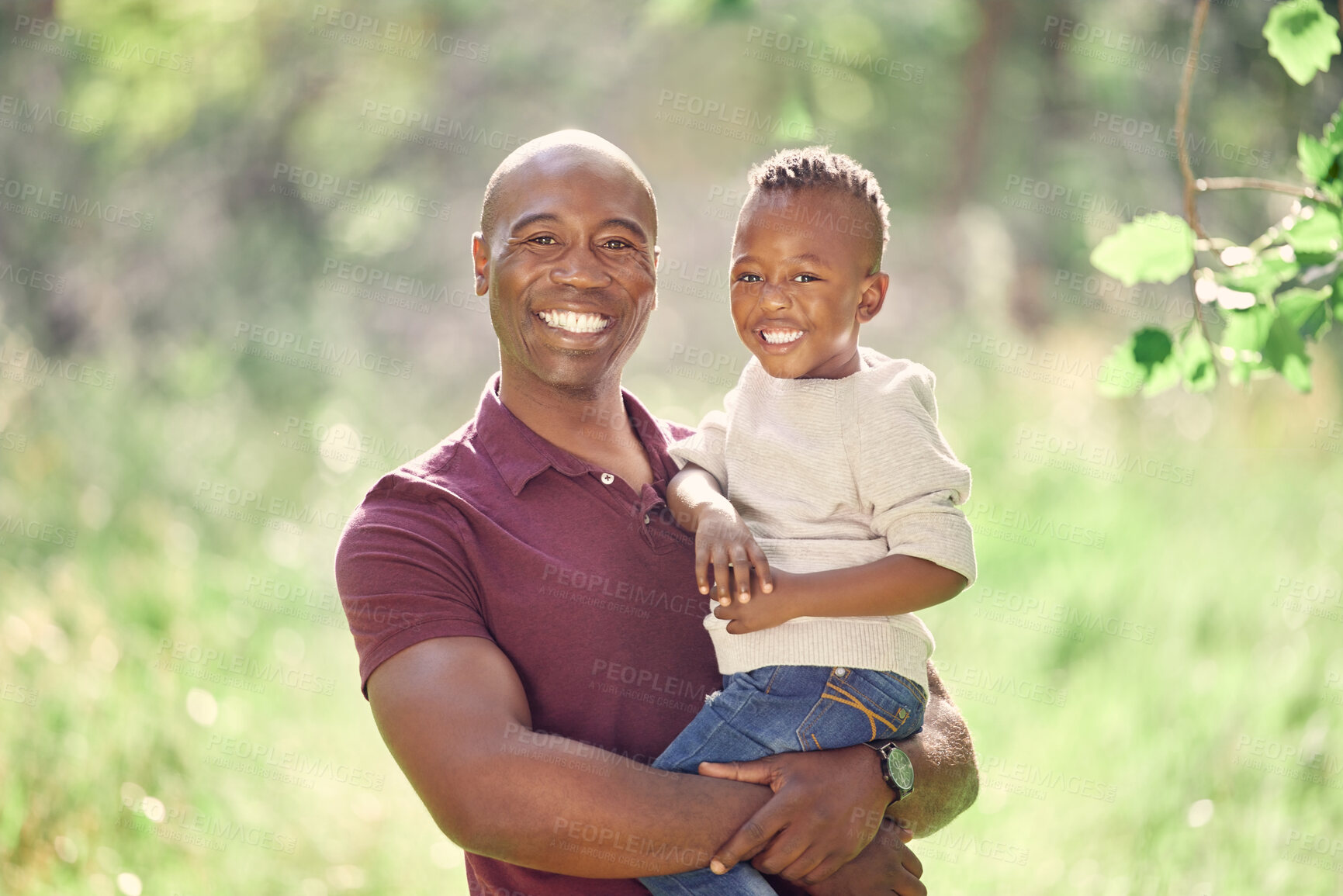 Buy stock photo Father, son and portrait in field for love, affection and support in outdoor nature to connect. Black family, happy and embrace for security in relationship, travel and care on vacation in woods