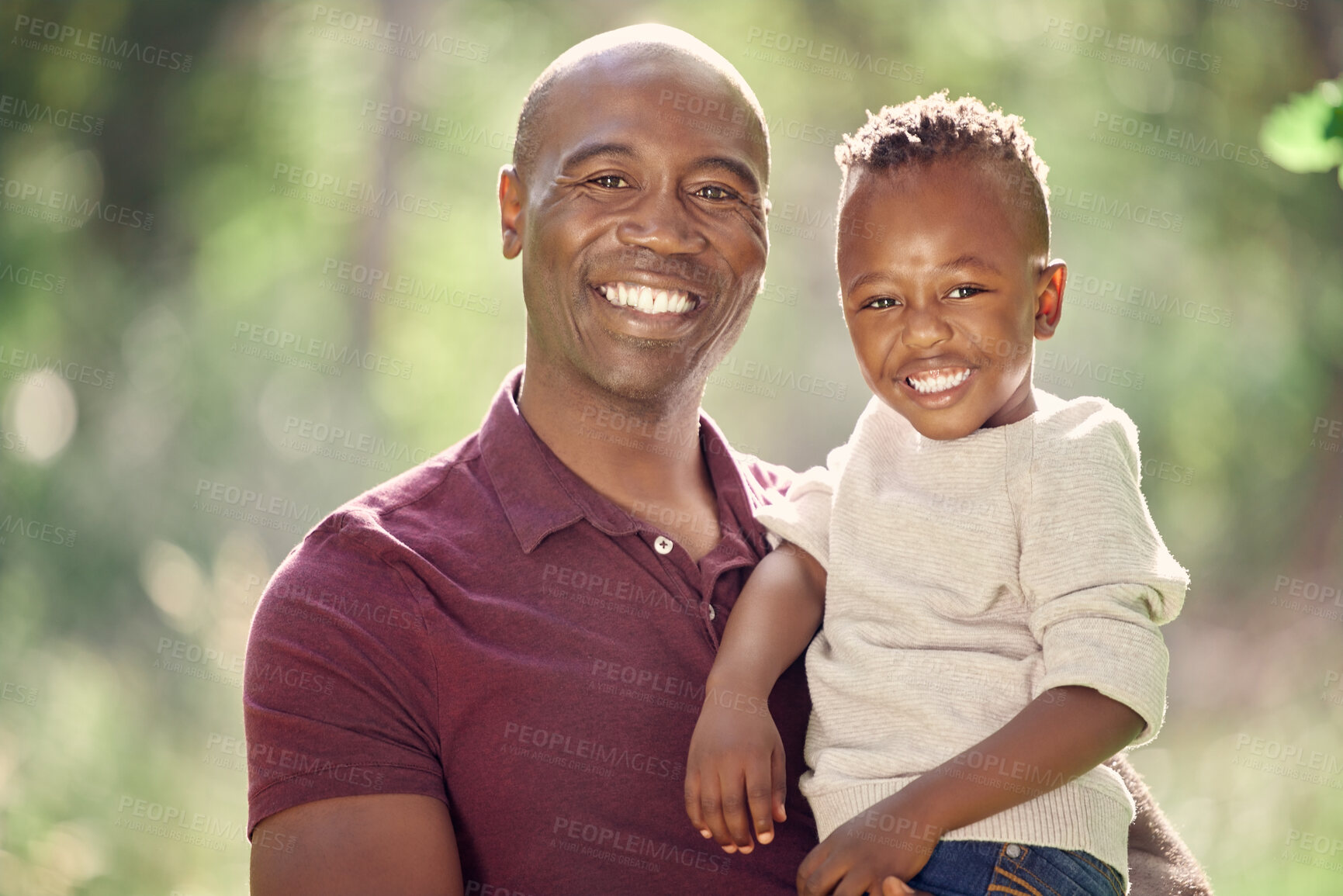 Buy stock photo Father, son and portrait in field for bonding, affection and support in outdoor nature to connect. Black family, happy and embrace for security in relationship, travel and care on vacation in woods