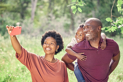 Buy stock photo Selfie, black family and smile in nature with child, picture and memory for social media, travel and holiday. Vacation, woman and man with happiness, photography and piggyback of kid with parents