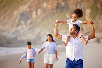 Buy stock photo Shot of a beautiful young family of three spending the day together at the beach