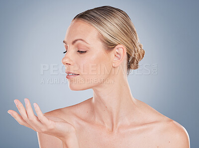 Buy stock photo Woman, thinking and hand with mockup for skincare, cosmetics or beauty in studio background. Dermatology, model and gesture for product placement or makeup in space with healthy glow on skin