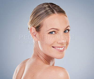 Buy stock photo Beauty, skincare and makeup with portrait of woman in studio for facial, cosmetics and natural. Self care, wellness and mockup with face of model on grey background for glow, happiness and collagen