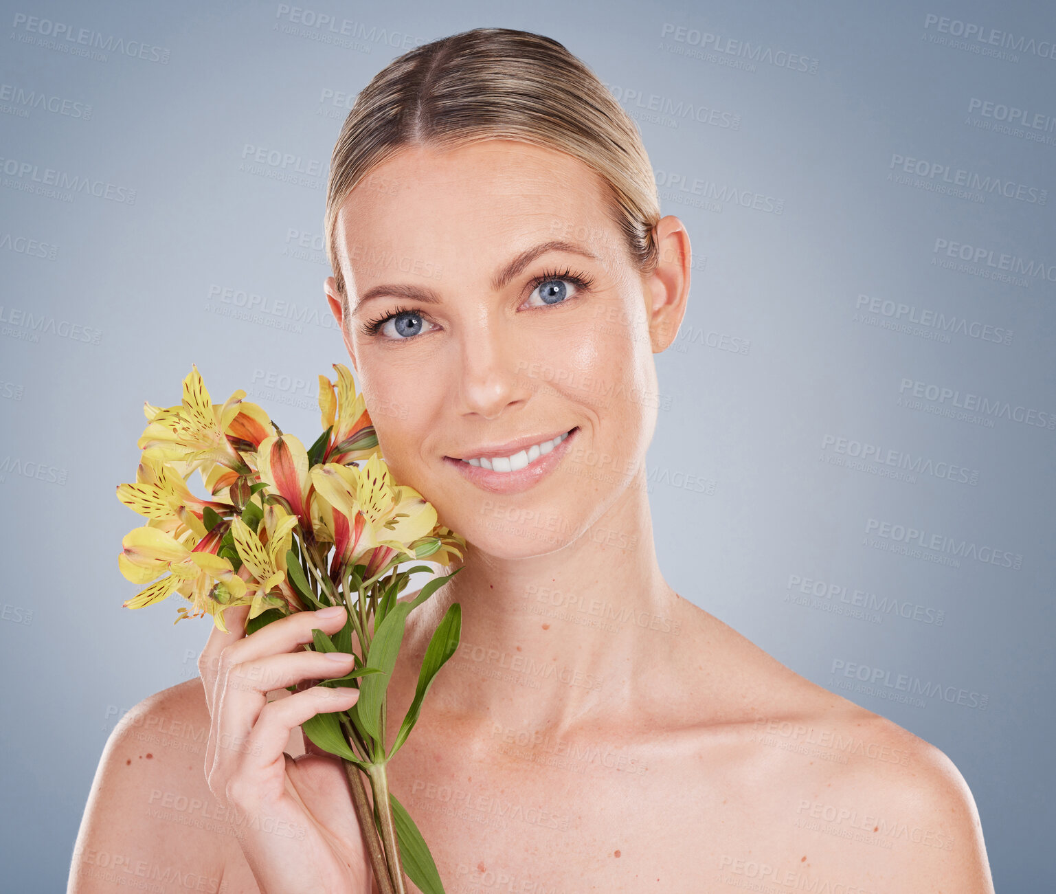 Buy stock photo Flowers, bouquet and portrait of woman with skincare or natural beauty on studio background. Floral, fragrance and model with clean dermatology cosmetics, perfume scent and makeup for spring