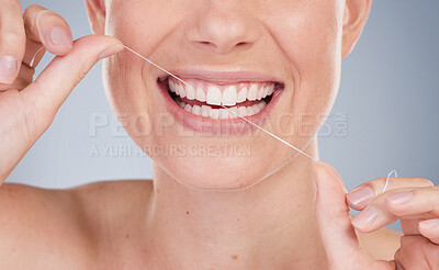 Buy stock photo Face, woman and floss in studio background for dental care, gum health and fresh breath. female model, plaque removal and tooth product for wellness, oral hygiene and prevention of cavities for teeth