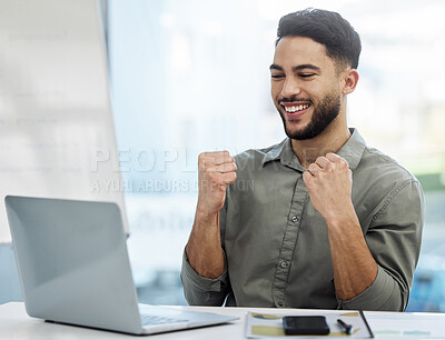 Buy stock photo Shot of a young businessman cheering in an office at work