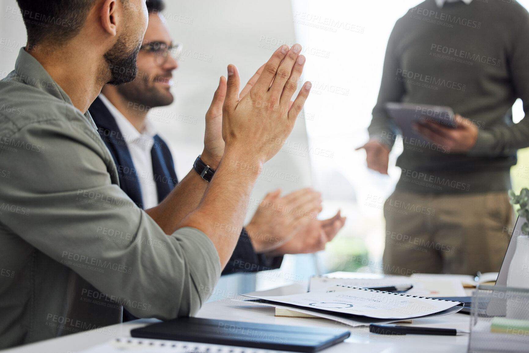 Buy stock photo Shot of two businesspeople clapping in a meeting at work
