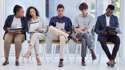 Buy stock photo Full length shot of a diverse group of businesspeople sitting in the office and waiting