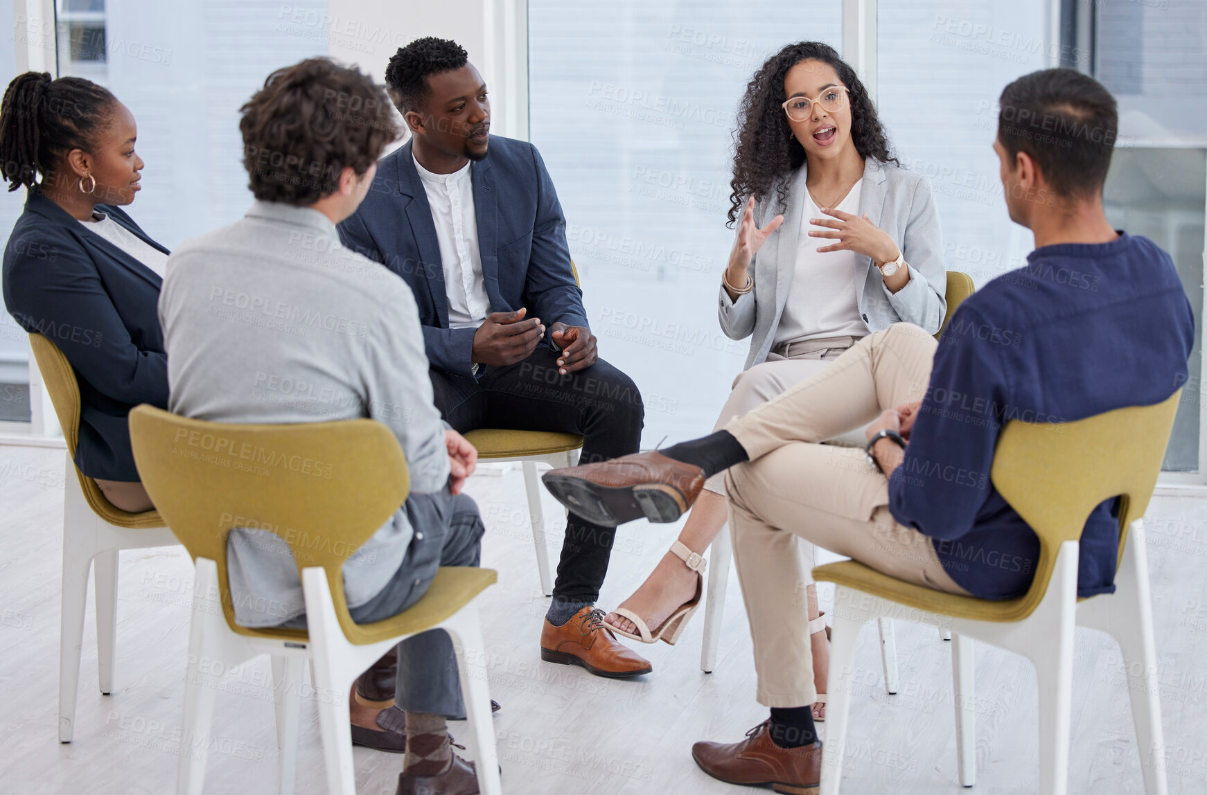 Buy stock photo Group, business meeting and discussion in circle for therapy, talking with diversity in office. Team, people or communication for mental health in conference room, international wellness with support