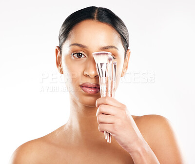 Buy stock photo Woman, portrait and face with brushes for makeup, beauty cosmetics or skincare against a white studio background. Female person or model with cosmetic brush, tools or equipment for facial foundation