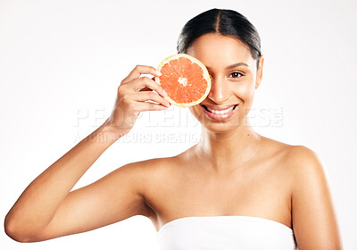 Buy stock photo Happy woman, portrait and grapefruit for vitamin C, diet or skincare against a white studio background. Female person smile with organic fruit in healthy nutrition, natural beauty or facial treatment