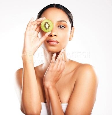 Buy stock photo Woman, portrait and face with kiwi for vitamin C, diet or skincare against a white studio background. Female person or model with natural fruit for healthy nutrition, collagen or facial treatment