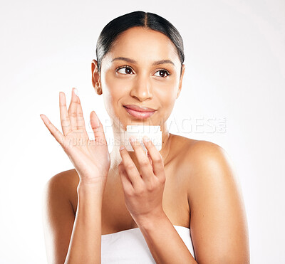 Buy stock photo Woman, face and cream for skincare, beauty or cosmetics against a white studio background. Female person or model with container product, lotion or creme and smile for dermatology or facial treatment