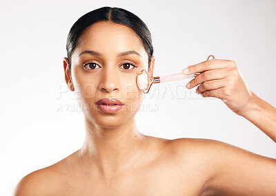 Buy stock photo Woman, portrait and face with derma roller in skincare, dermatology or beauty against a white studio background. Female person or model rolling skin in healthy wellness, self care or facial treatment