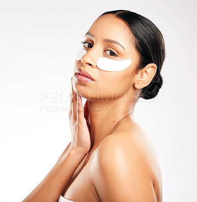 Buy stock photo Woman, portrait and eye pads for skincare, beauty or cosmetics against a white studio background. Face of female person or model with facial collagen mask under eyes for anti aging or dermatology