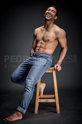 Buy stock photo Smile, muscle and man with fitness, wellness and strong model against a dark studio background. Happy male person, humor and guy laughing, chair and muscular with body builder, sexy and workout goal