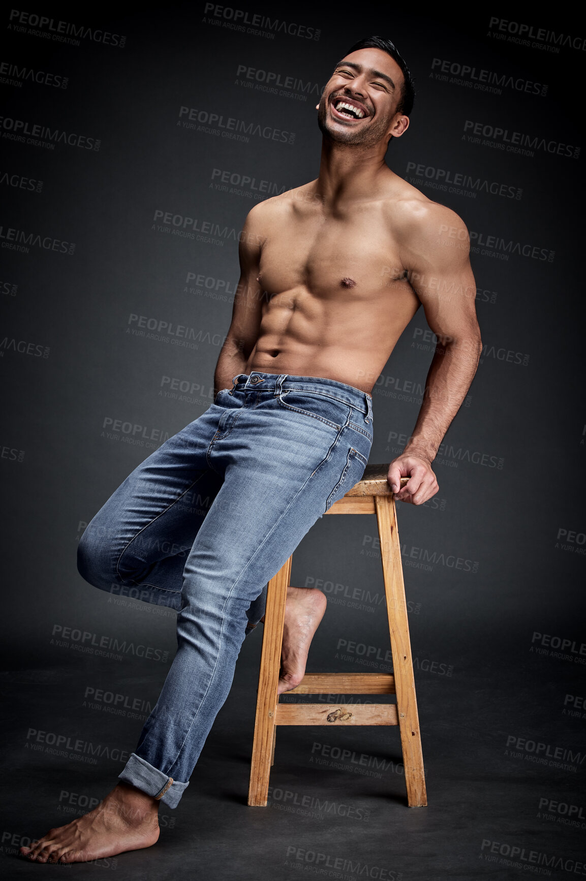 Buy stock photo Smile, muscle and man with fitness, wellness and strong model against a dark studio background. Happy male person, humor and guy laughing, chair and muscular with body builder, sexy and workout goal