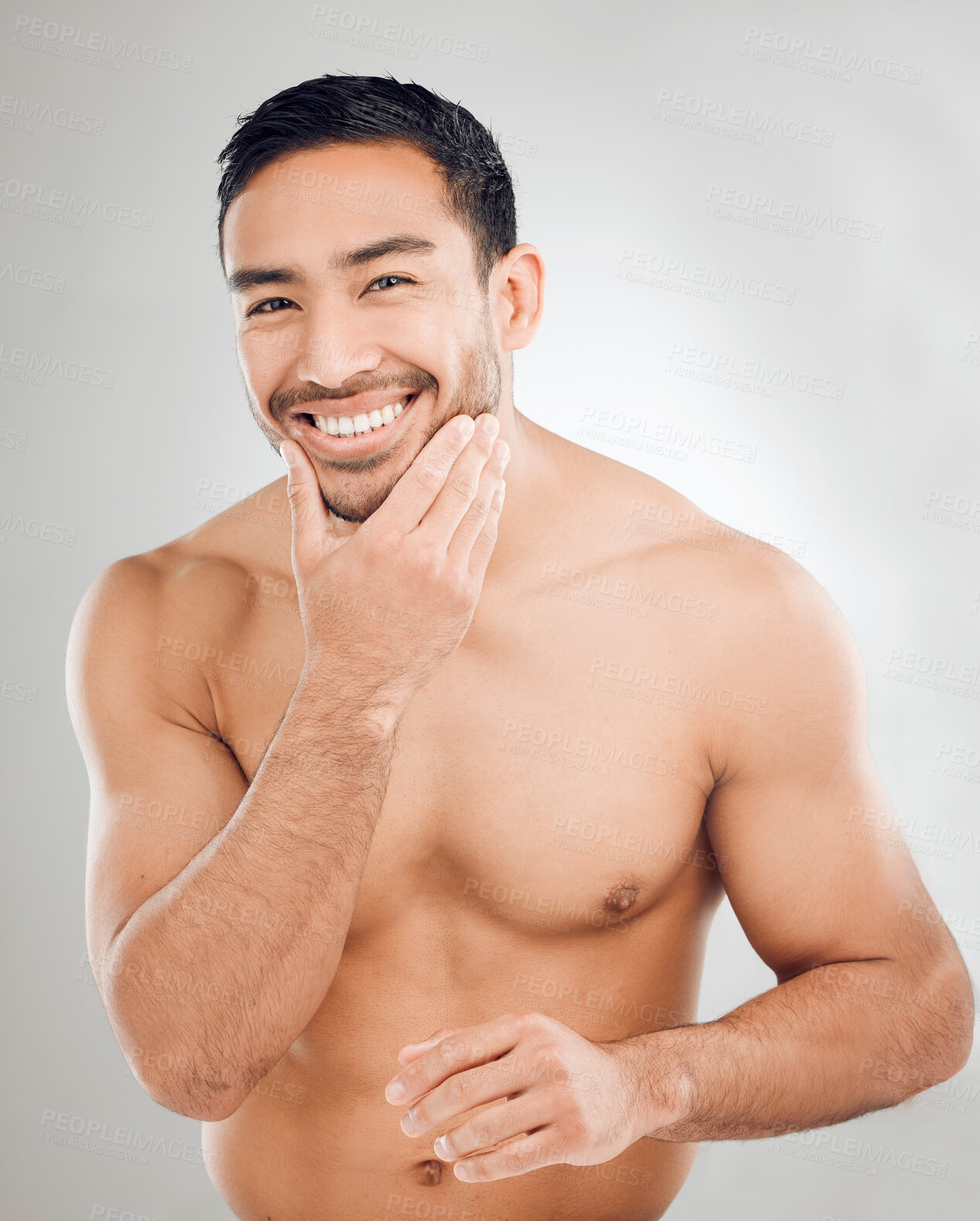 Buy stock photo Asian man, hand and portrait of grooming in studio for morning routine, wellness or natural treatment on white background. Skincare, body and model with smile for confidence, facial or satisfaction