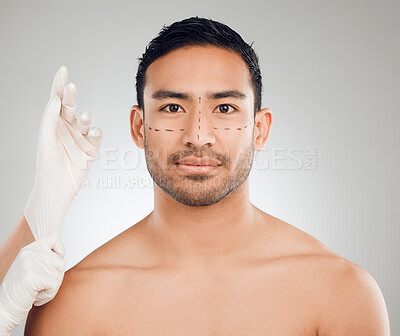 Buy stock photo Man, portrait and drawing marks on face for plastic surgery, rhinoplasty and cosmetic procedure in studio. Male person, hands and needle or syringe placement for facelift, nose job and blepharoplasty