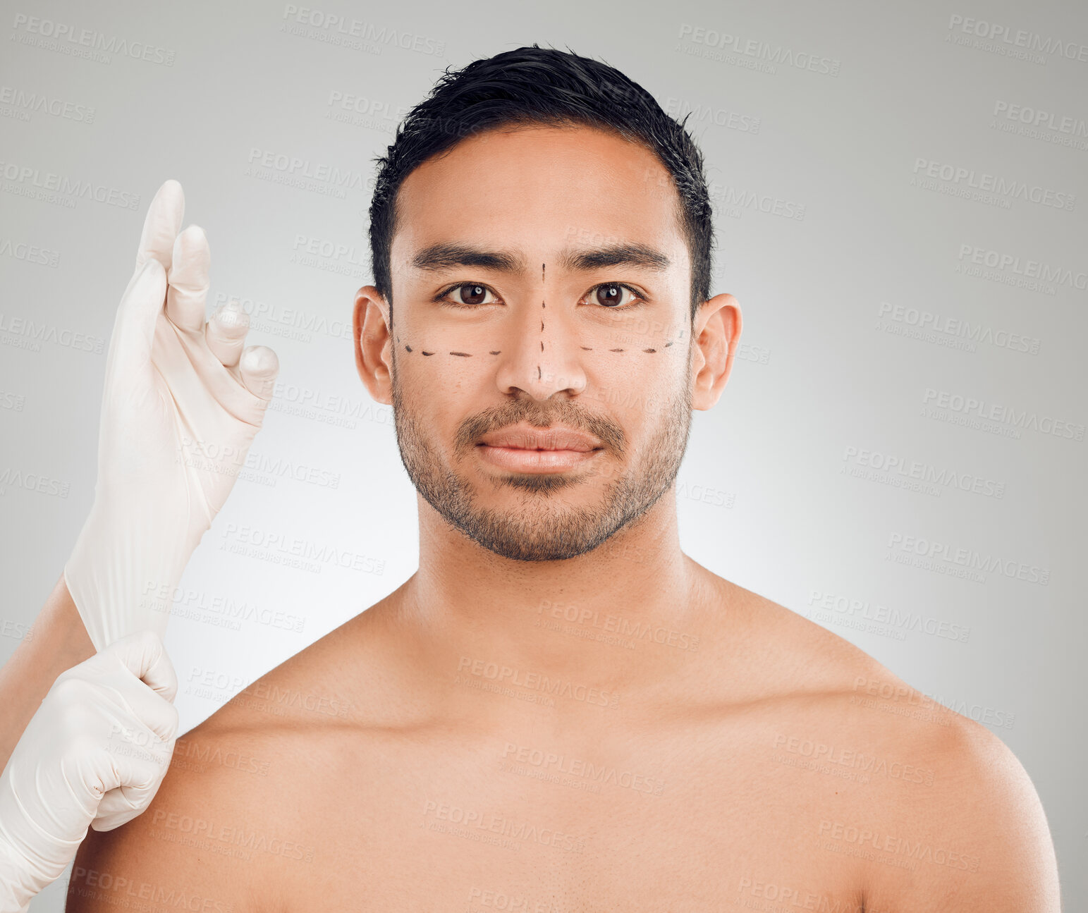 Buy stock photo Man, portrait and drawing marks on face for plastic surgery, rhinoplasty and cosmetic procedure in studio. Male person, hands and needle or syringe placement for facelift, nose job and blepharoplasty