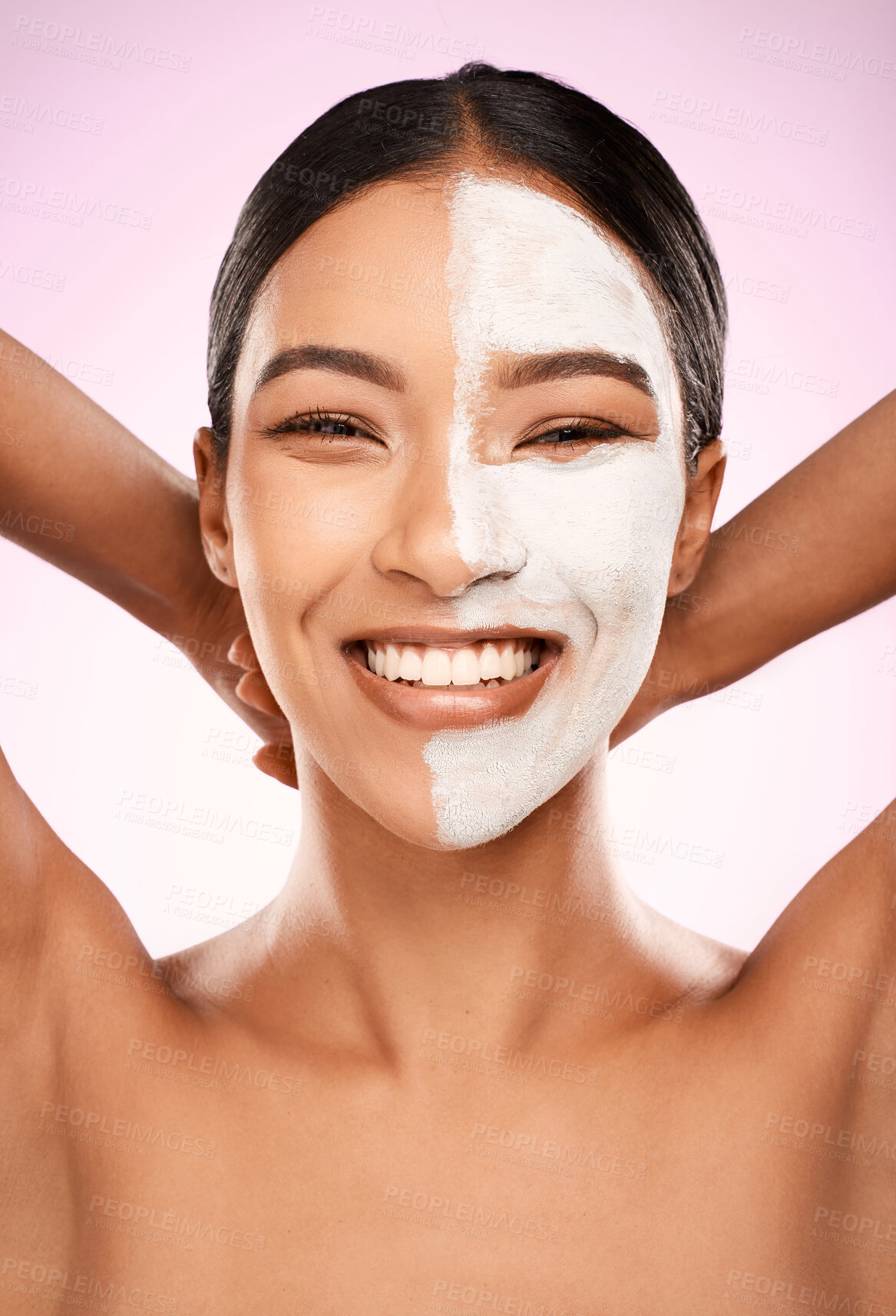 Buy stock photo Studio shot of an attractive young woman having a facial against a pink background