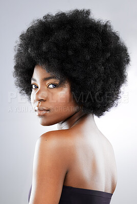 Buy stock photo Studio portrait of an attractive young woman posing against a grey background