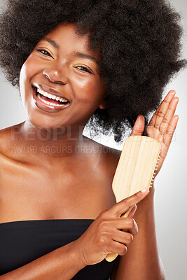 Buy stock photo Happy, portrait and black woman with hair brush in studio for healthy growth, keratin treatment or afro hairstyle aesthetic. Female person, wellness and natural texture, cosmetics on white background