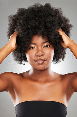 Buy stock photo Texture, afro and studio portrait of black woman for hair care, treatment and maintenance. Face, pride and model girl for beauty, growth and confidence for glow, shine or aesthetic by grey background