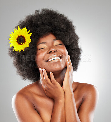 Buy stock photo Black woman, smile or sunflower for hair care, afro aesthetic or beauty transformation with wellness. Happy African person, studio or floral cosmetics on white background for salon treatment or skin