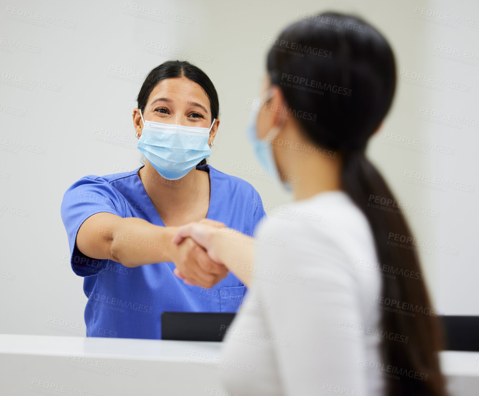 Buy stock photo Woman, nurse and handshake with mask in hospital, happy and patient or medical employee for trust and support. Shaking hands, clinic and healthcare together or wellness safety, thank you and greeting