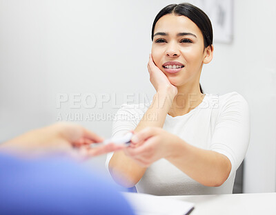 Buy stock photo Shot of a young woman with tooth ache in a dentist office